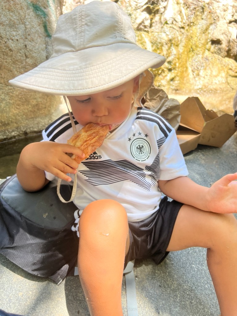 Family posing in Anguilla by the turquoise water