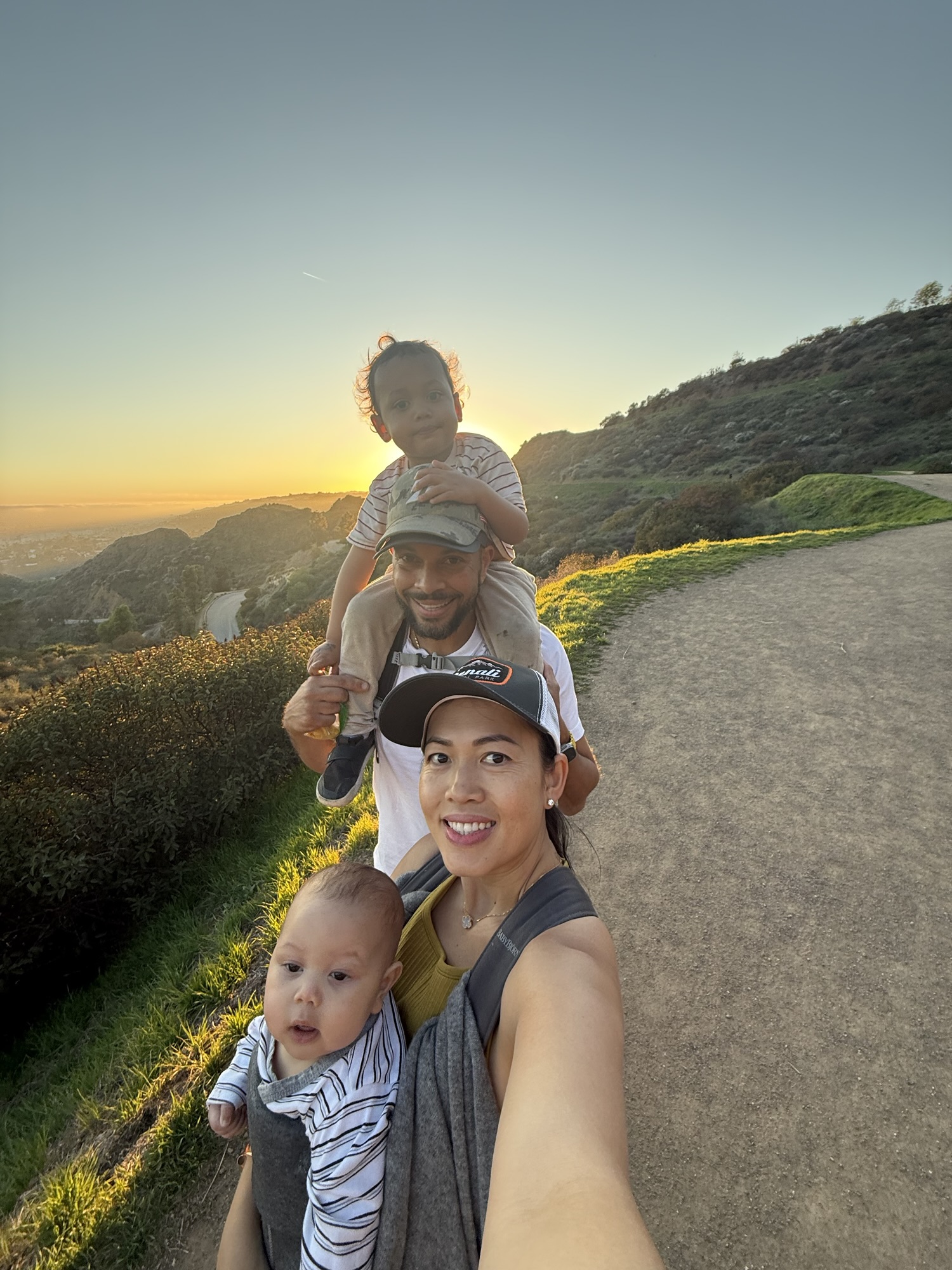 Mom hiking with baby and toddler