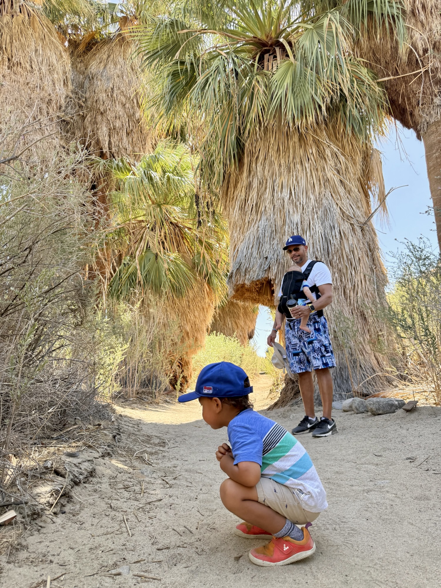 Paxton watching insects along the trail at Omni Rancho Las Palmas