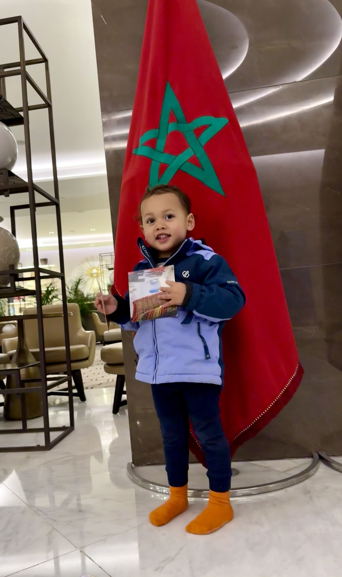 TTE in Morocco - child in front of Moroccan flag