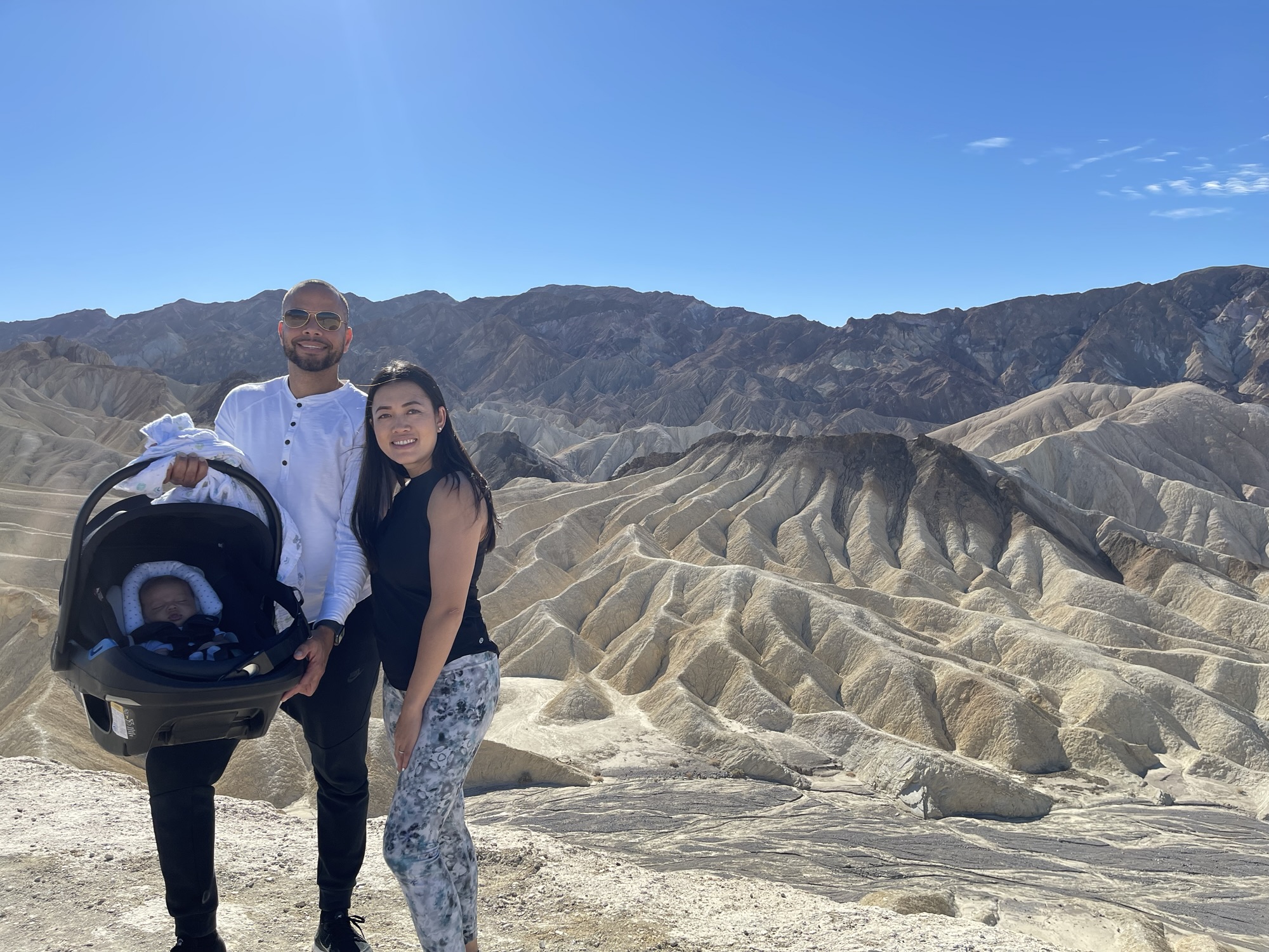 Death Valley - family with baby amid desert landscape