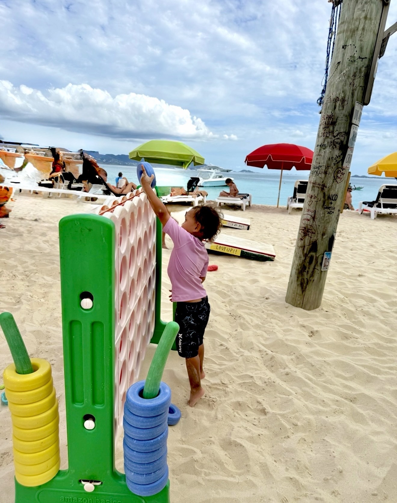 Kids playing in the sand and enjoying lunch at Sunshine Shack in Anguilla