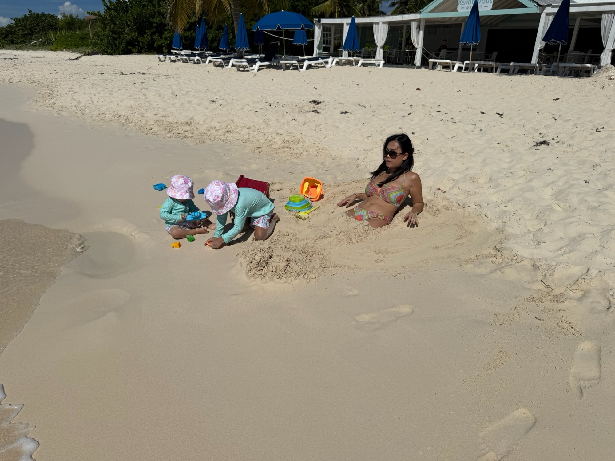 Family enjoying breakfast and a post-meal swim at The Place restaurant on Rendezvous Bay